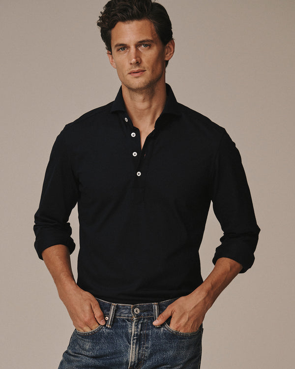 Model, Garrett Neff, wearing the Jonathan Mezibov navy Piqué Polo Shirt.