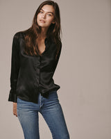 Female model wearing the black Victoria Silk Shirt with jeans.
