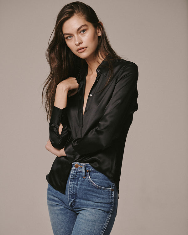 Female model wearing the Jonathan Mezibov black Victoria Silk Shirt, made in Italy.