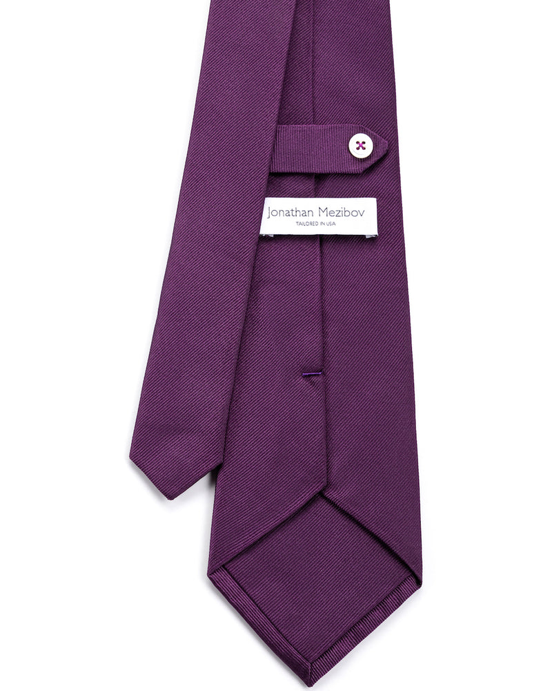 Close-up of the signature tab keeper loop on the Jonathan Mezibov iris Silk Faille Tie.