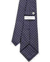 Close-up of the signature tab keeper loop on the Dotted Silk Jacquard Tie.