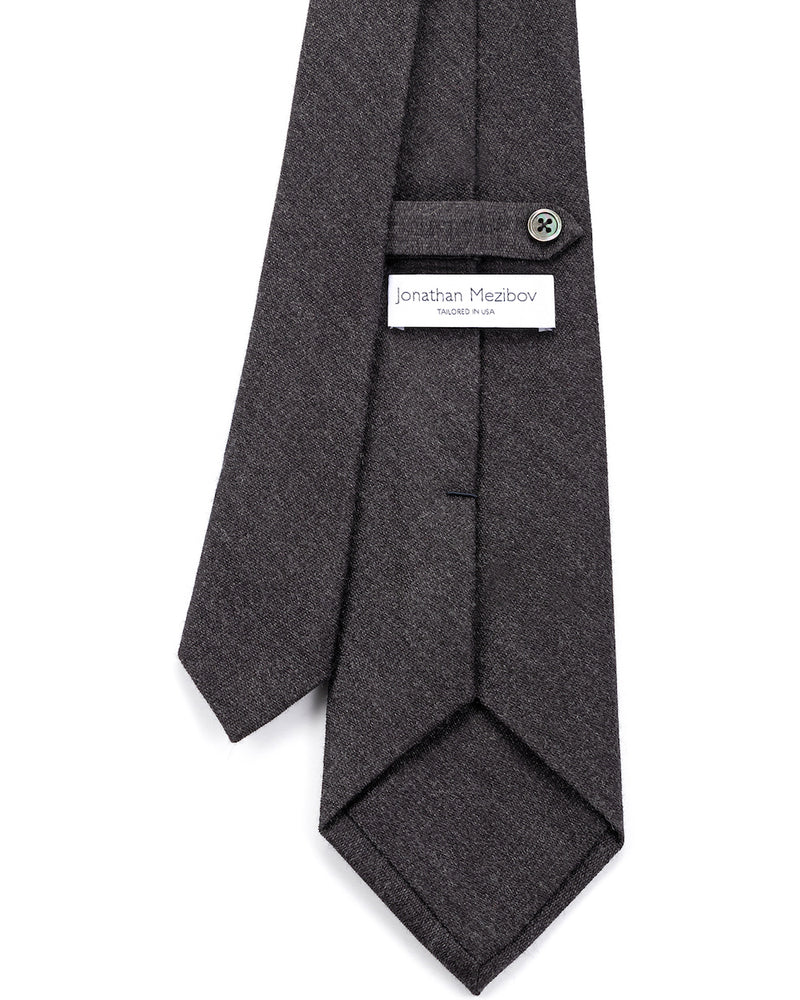 Close-up of the signature tab keeper loop on the Jonathan Mezibov Woven Wool-Silk Tie.