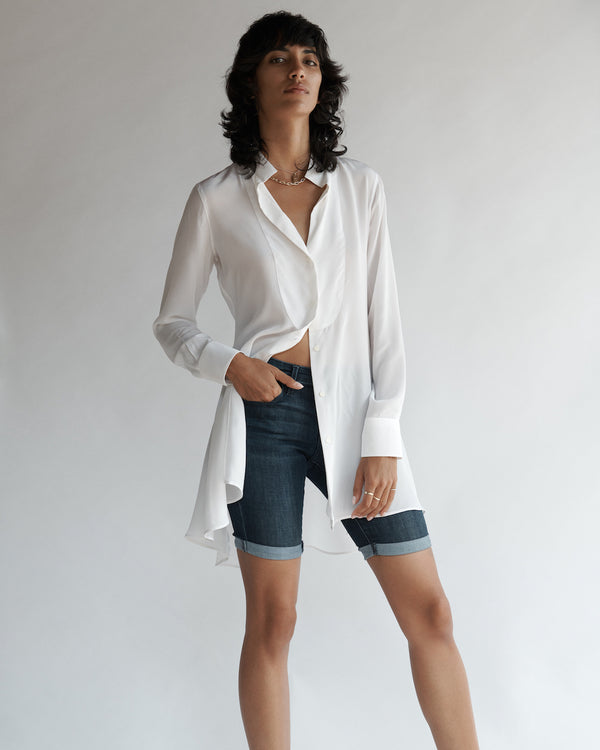 Female model wearing the Diana Silk Crepe de Chine Shirt with jean shorts and sandals.