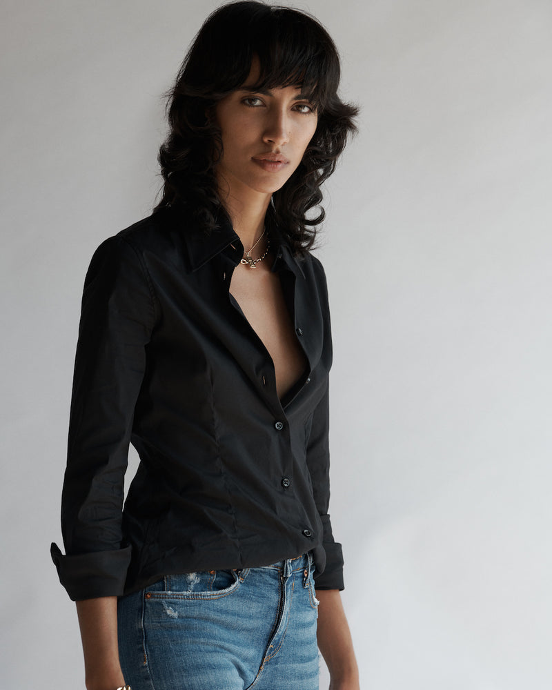 Female model wearing the Lisette Stretch Poplin Shirt and jeans.