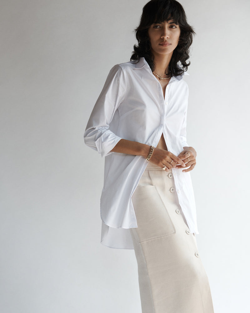 Female model wearing the Annette Poplin Shirt and long skirt.