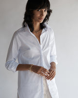 Close-up of a female model wearing the Annette Poplin Shirt.