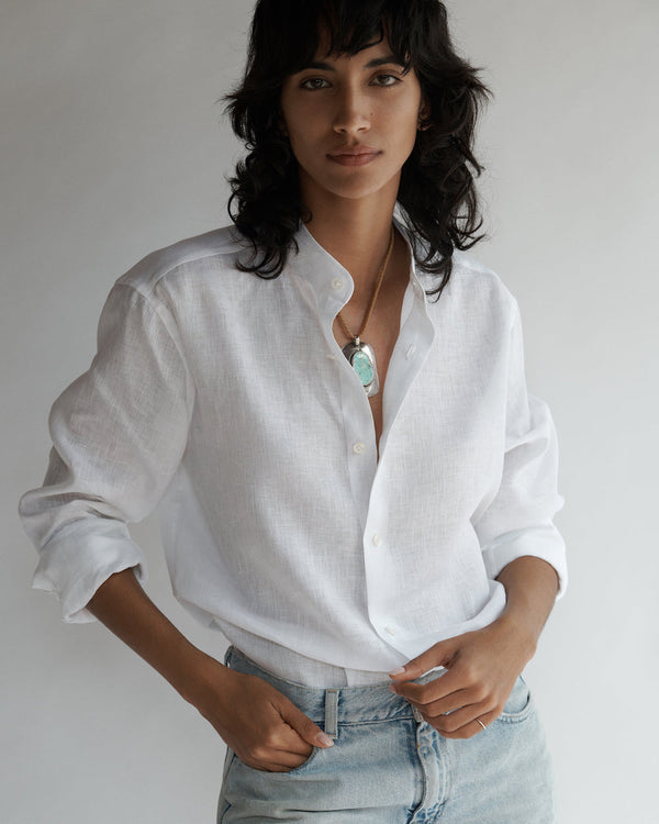 Close-up of a female model wearing the Band Collar Linen Shirt.