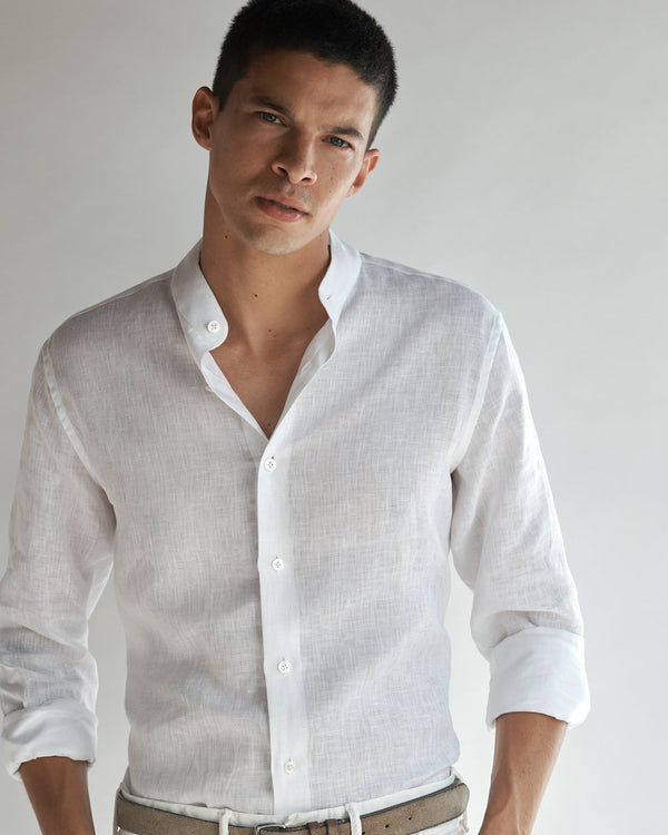 Close-up of a male model wearing the Band Collar Linen Shirt.