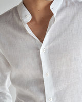 Close-up of front placket and mother-of-pearl buttons on the Band Collar Linen Shirt.