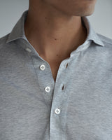 Close-up of the polo shirt opening and Australian mother-of-pearl buttons on the Pearson Jersey Polo Shirt.