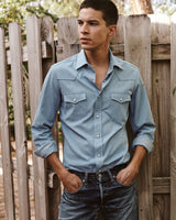 Male model wearing the Jonathan Mezibov Bleached Denim Western Shirt.