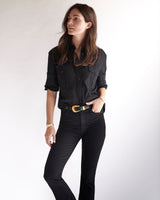 Female model wearing our Italian-made Fletcher Twill Military Shirt and black jeans.