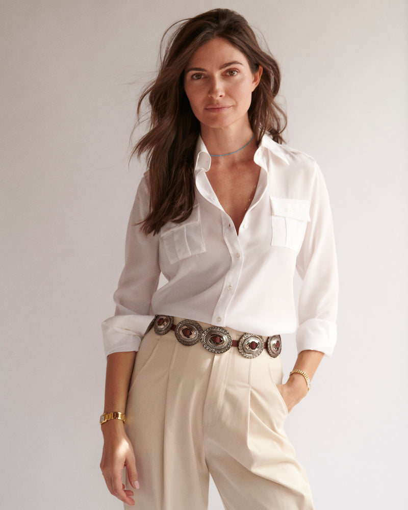 Female model wearing the Jonathan Mezibov white Silk Crepe de Chine Military Shirt, made in Italy.