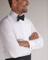 Male model wearing the Classic Collar Evening Shirt with a bowtie and cummerbund.