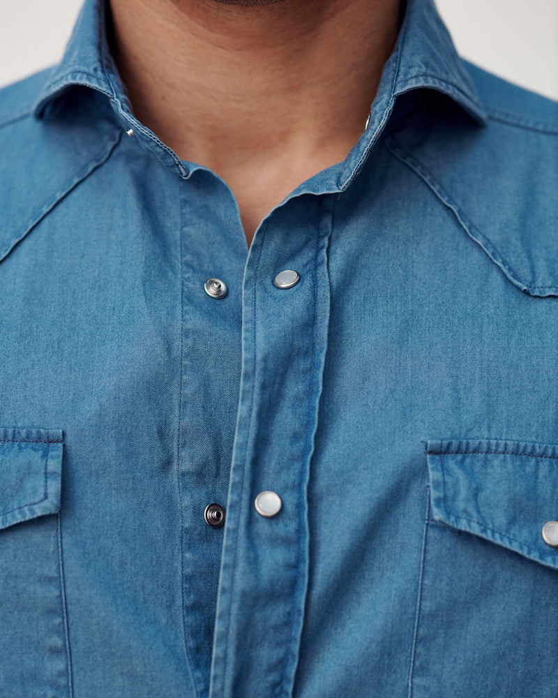 Our Stone Washed Western Shirt features a cutaway collar, traditional pearlized snap buttons, and snap-flap chest pockets.