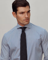 Male model wearing the Pearson Bengal-Striped Poplin Shirt and Woven Wool-Silk Tie.