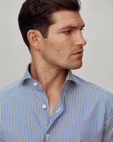Close-up of a male model wearing the Pearson Bengal-Striped Poplin Shirt.